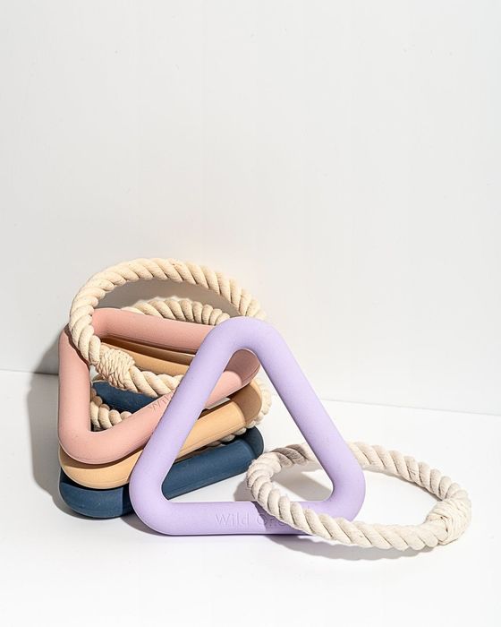 The toy in shades of pink, purple, beige, and blue