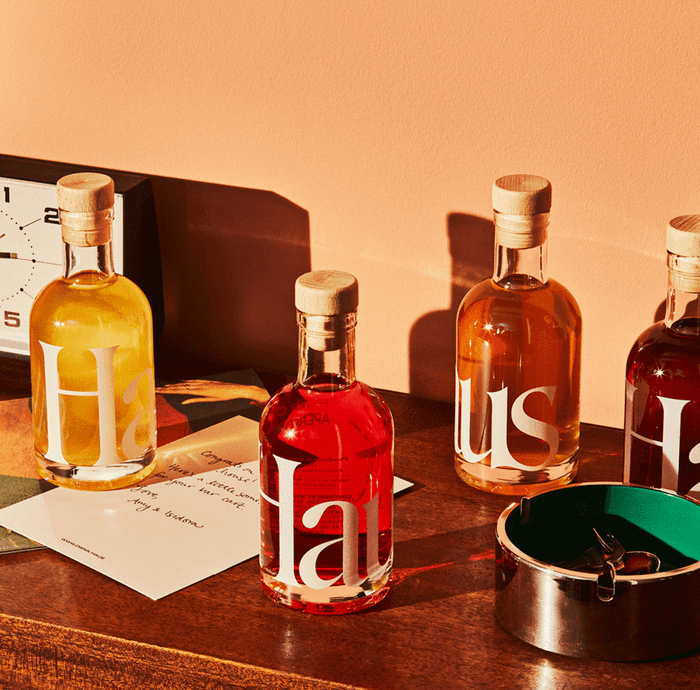 four miniature bottles of apéritif