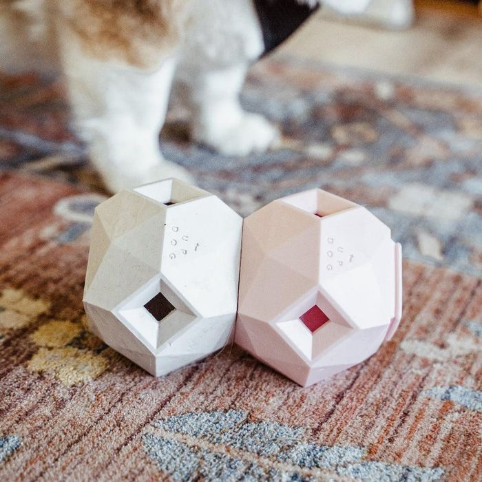 A close-up shot of two of the treat-dispensing toys connected together