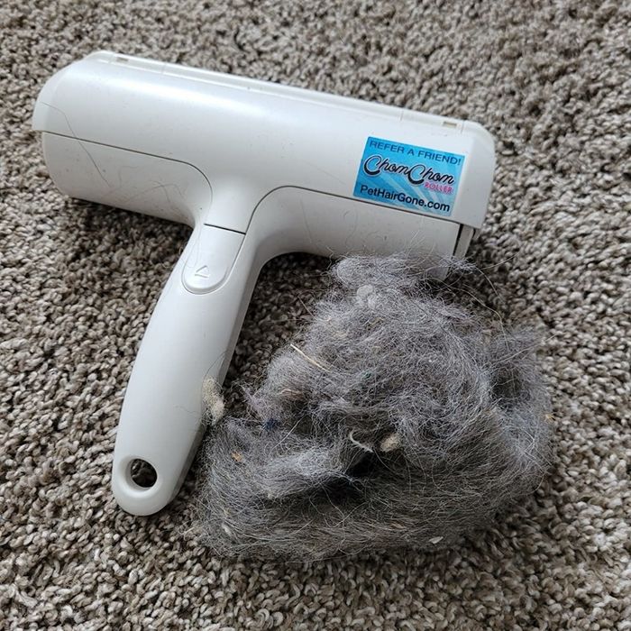 The same reviewer showing the hair scraped out from the pet hair remover.