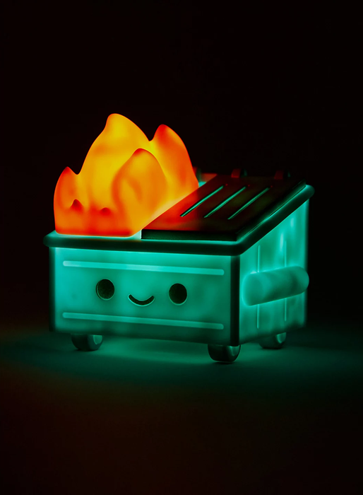 A glowing, smiling dumpster with fire coming out of it.
