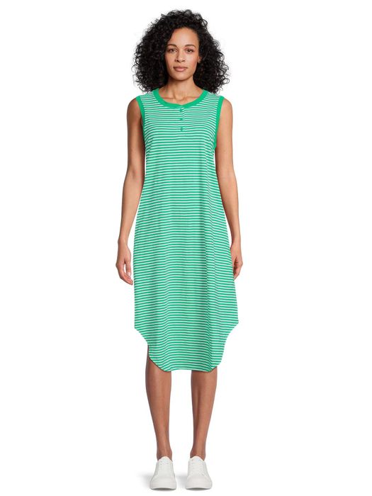 Model sporting the green and white striped dress paired with white sneakers