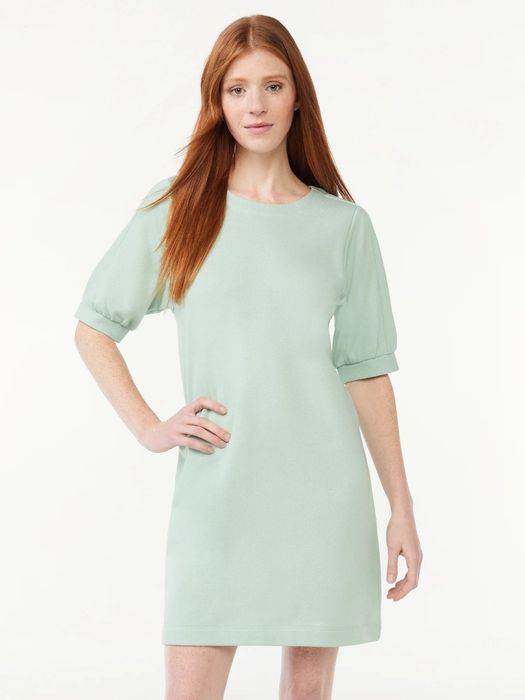 The model is wearing the silt green dress.