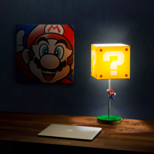 A lampshade shaped like a question block, featuring a Mario charm attached to the pull cord
