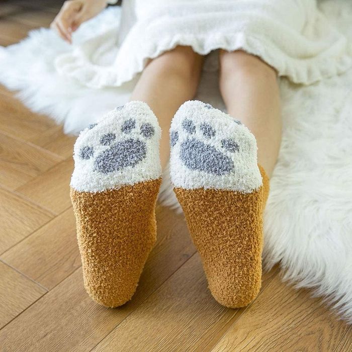 Bottom of socks adorned with paw prints