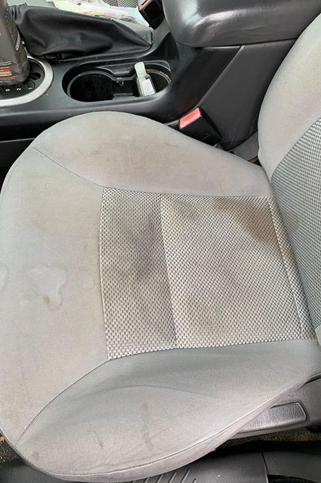 A reviewer displaying the stains on their car seat.