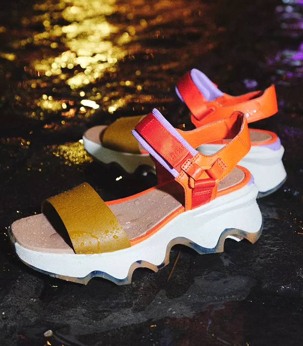 The sandals in vibrant orange, purple, and yellow