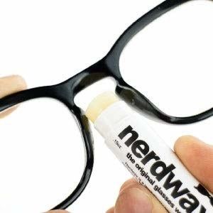 Hands applying Nerdwax, shaped like a typical Chapstick tube for easy use
