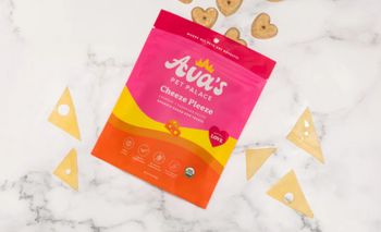 The package with heart-shaped treats spilling out across the table.