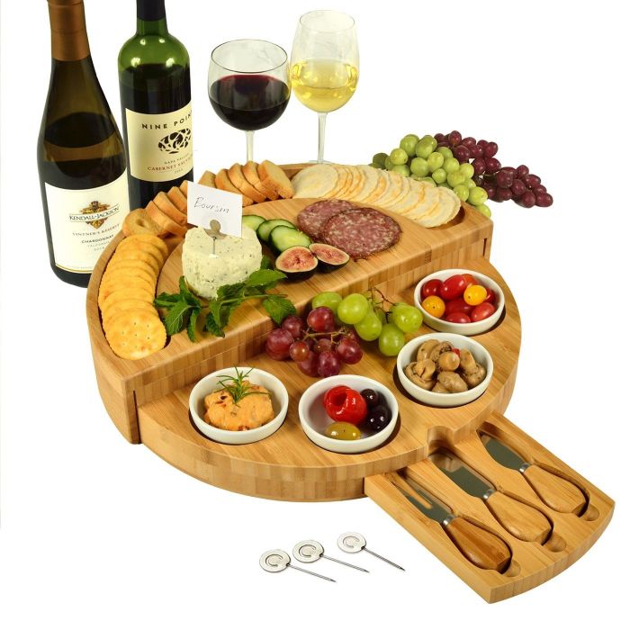 A beautifully arranged cheese board with charcuterie