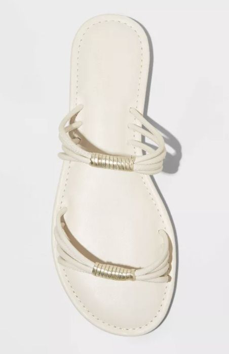 A sandal featuring two rope-like straps accented with gold-tone bands, shown from above