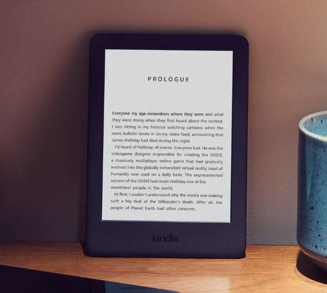 A black Amazon Kindle placed on top of a desk