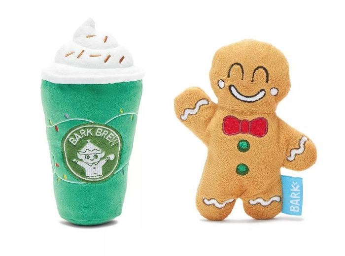 A bark brew coffee cup dog toy and a gingerbread man dog toy