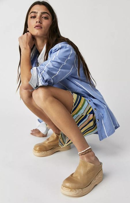 a person wearing the tan clog