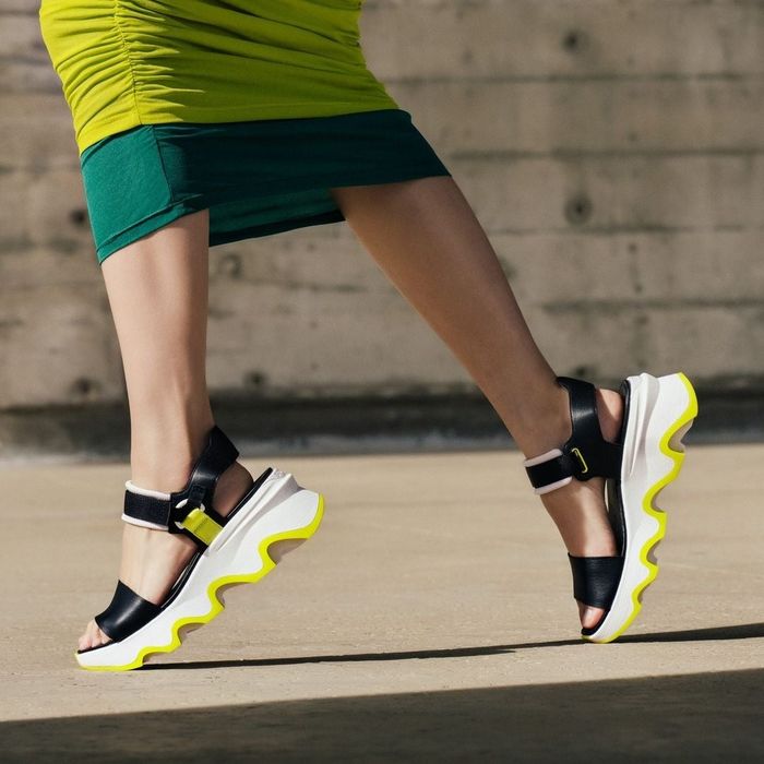 A model wearing the Sorel Kinetic sandals.
