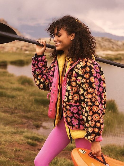 Model wearing the floral print fleece jacket