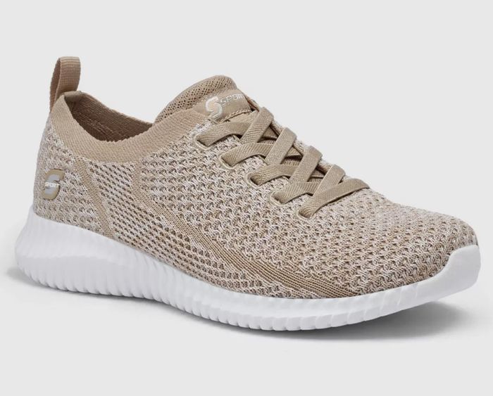 side view of the shoe in cream with a white sole