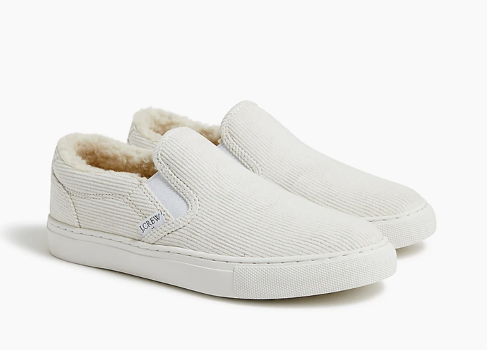 The cream-colored sneakers