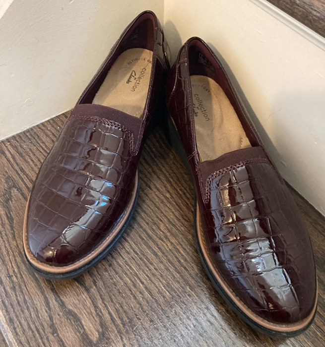 A reviewer's photo showcasing the burgundy loafers