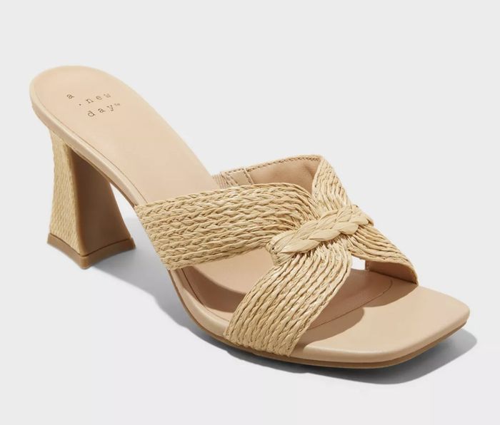 Beige heeled sandal featuring a braided rope upper that adds texture and charm