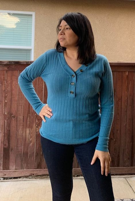 Another reviewer wearing the top in a blue shade