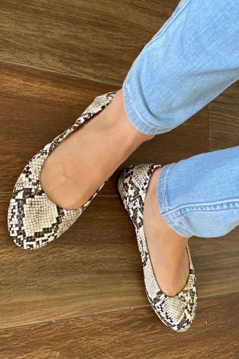 Another reviewer rocking snakeskin flats paired with blue jeans