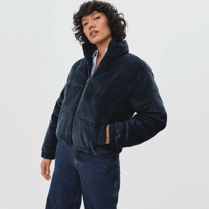 Another model showcasing the navy jacket, exuding effortless style