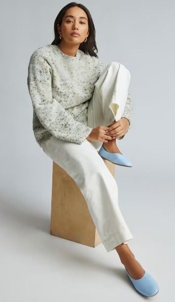 Model wearing the light blue flats