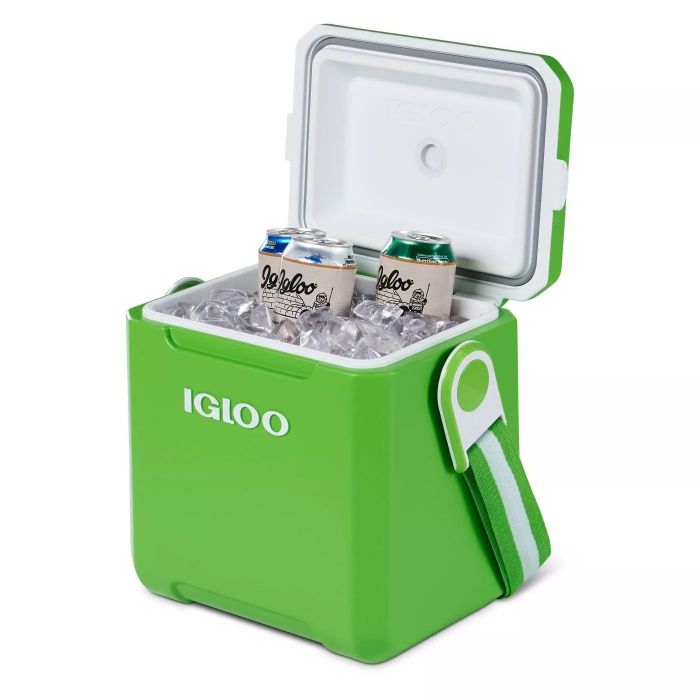 The green cooler with matching straps, packed with several cold drinks inside, ready for an adventure.