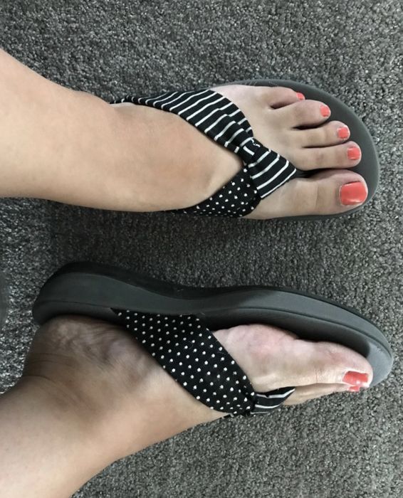 a reviewer rocking the shoes in black with white polka dots
