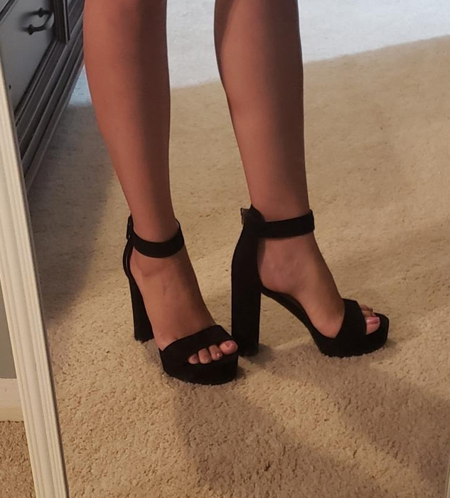 Reviewer wearing black heels