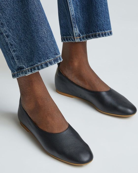 Model showcasing the black flats