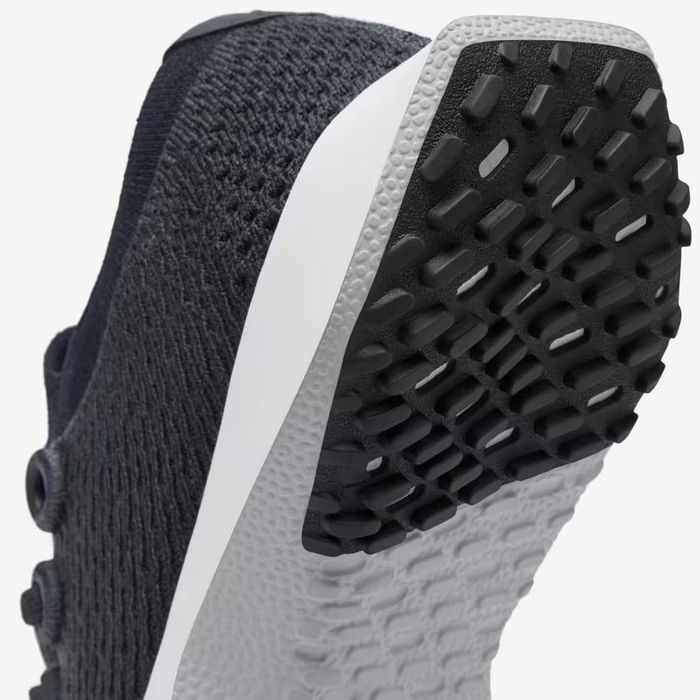 A product image showcasing the traction of the running shoe's sole.
