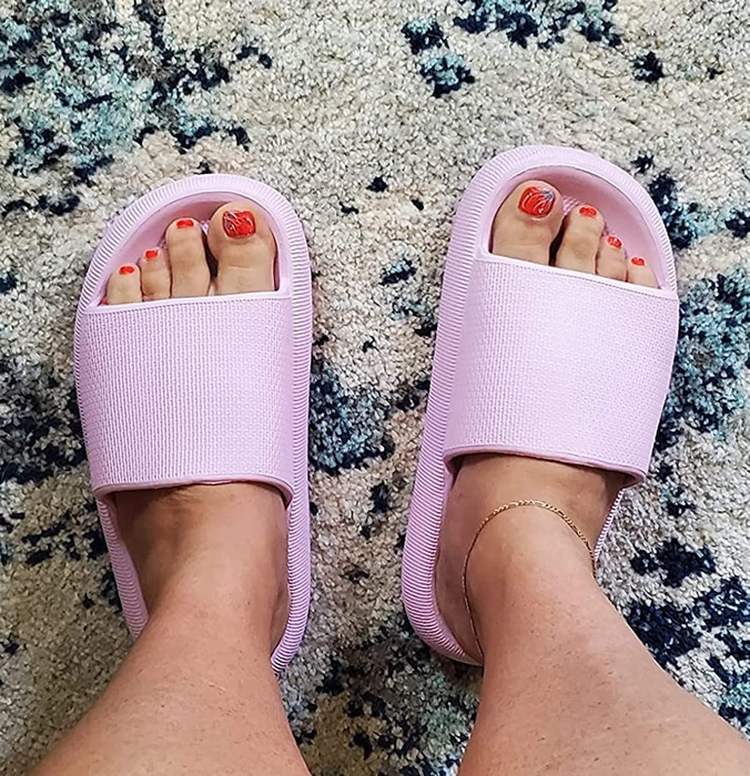A reviewer wearing the lavender sandals.