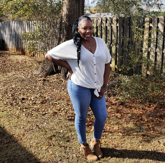 A reviewer wearing the button-down shirt paired with jeans