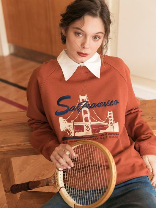 A model wearing the San Francisco embroidered sweatshirt