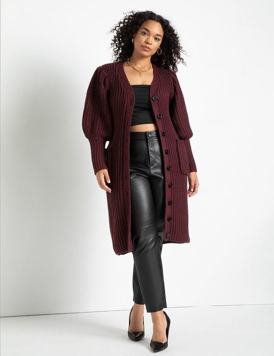 another model sporting the burgundy version, worn open as a cardigan