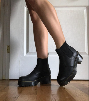 Close-up of reviewer wearing slip-on boots