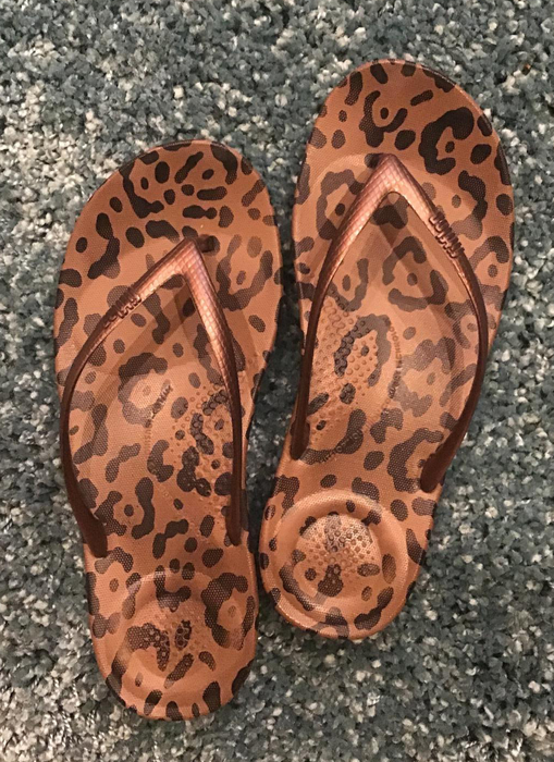 Leopard print flip-flops with a trendy, bold design.