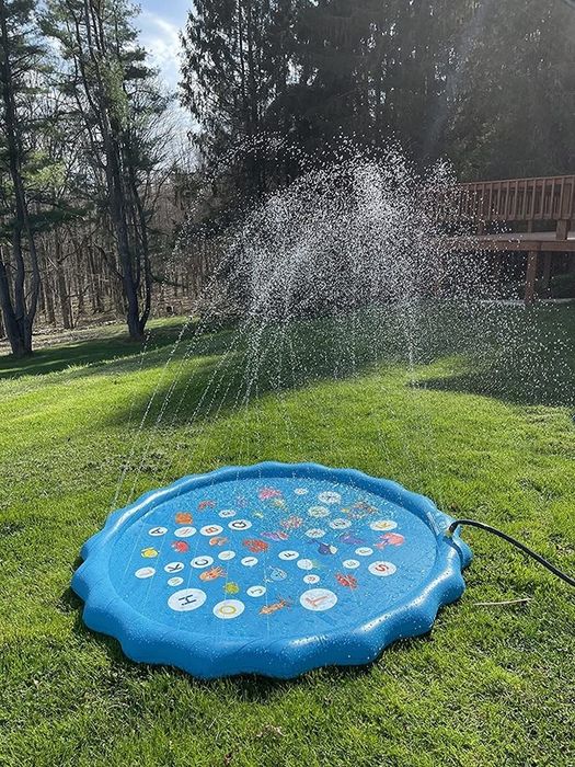 A reviewer's photo of the splash pad with water spraying out