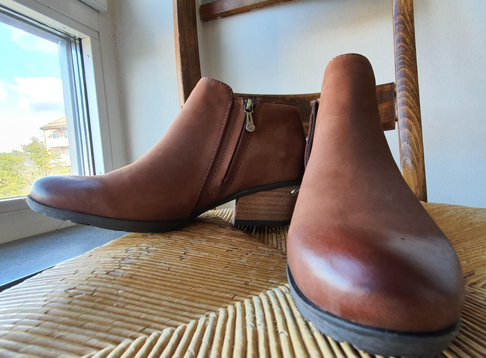 Brown ankle boots with a slight heel.