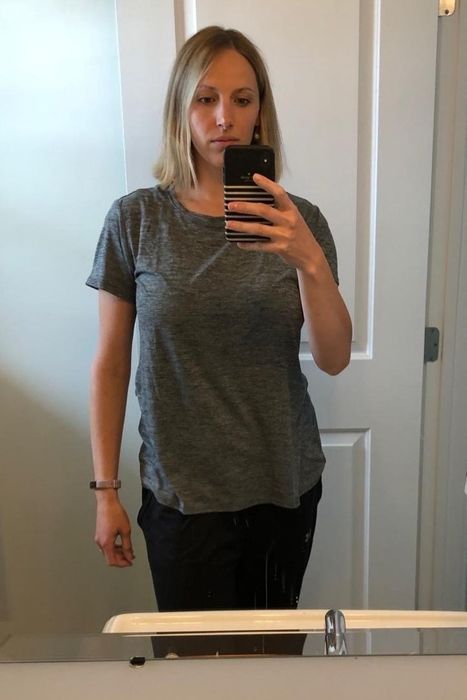 A reviewer modeling the T-shirt.