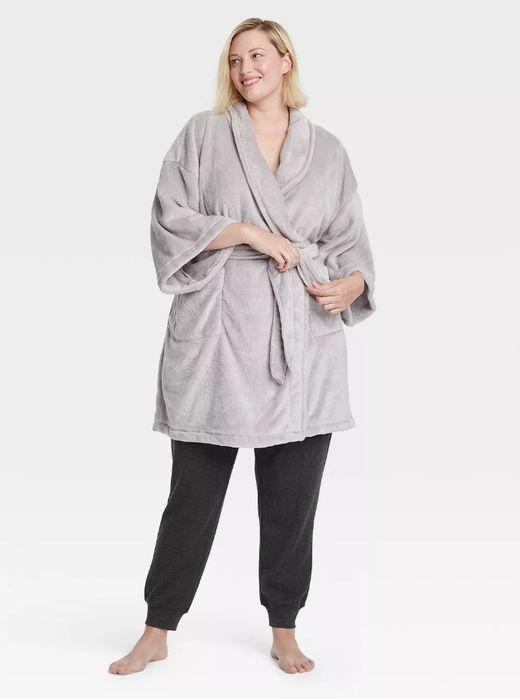 A person modeling a grey robe