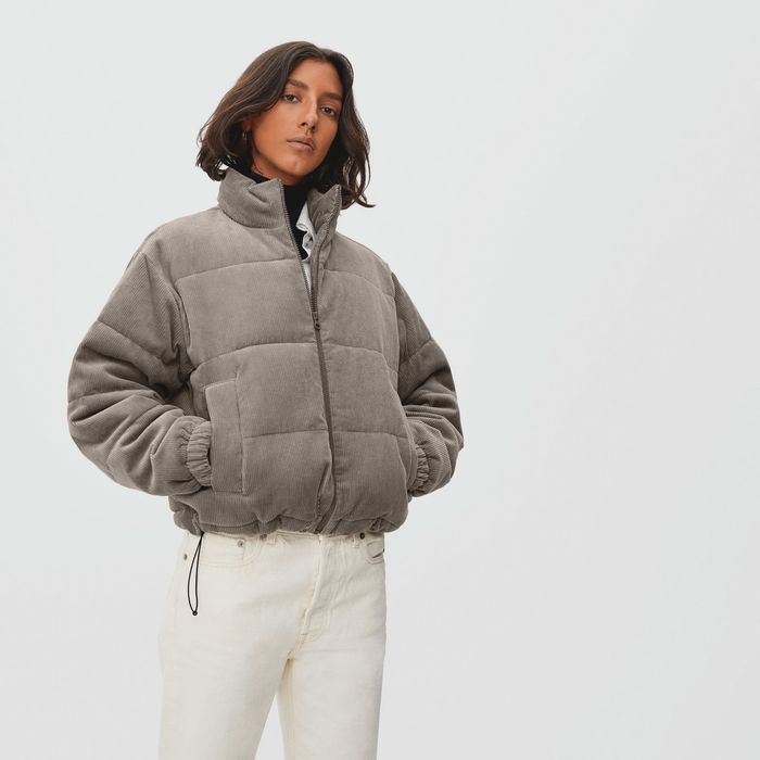 model wearing the jacket in a clay color, looking effortlessly stylish and cozy