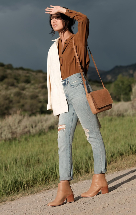 Model showcasing the brown boots