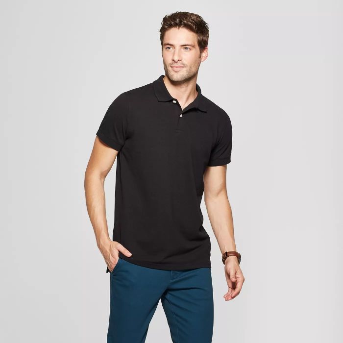 A model showcasing the black short-sleeve Polo T-shirt.
