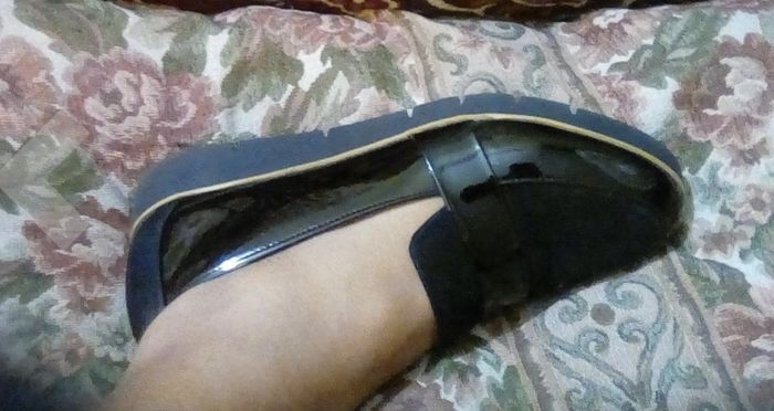 a side view highlighting the sole of the loafer
