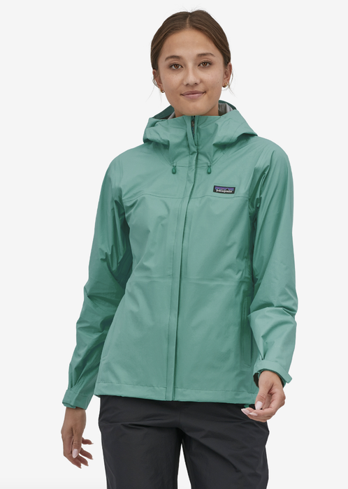 Model dressed in a teal hooded hard shell jacket