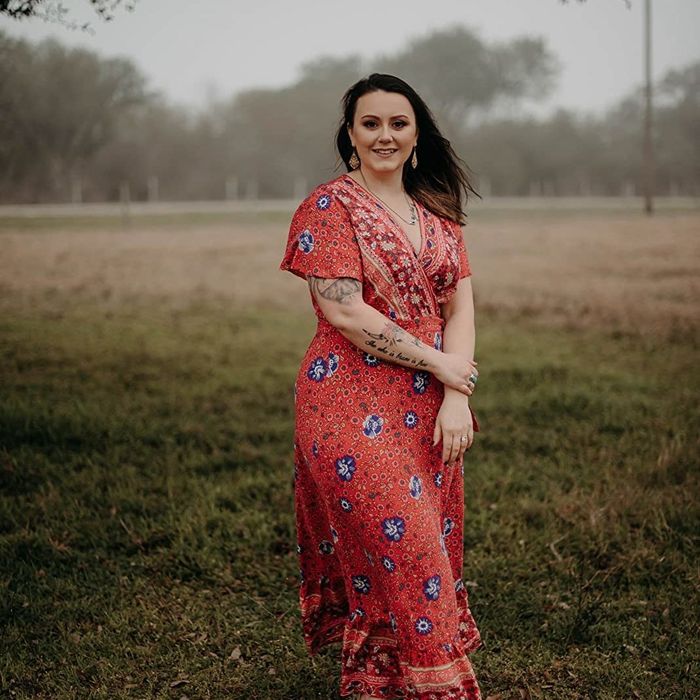 Reviewer is wearing the same dress, but in a vibrant red color.