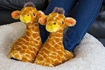 A model wearing giraffe-shaped slippers